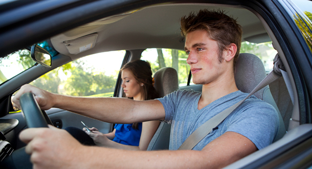 teen driver and passenger in car