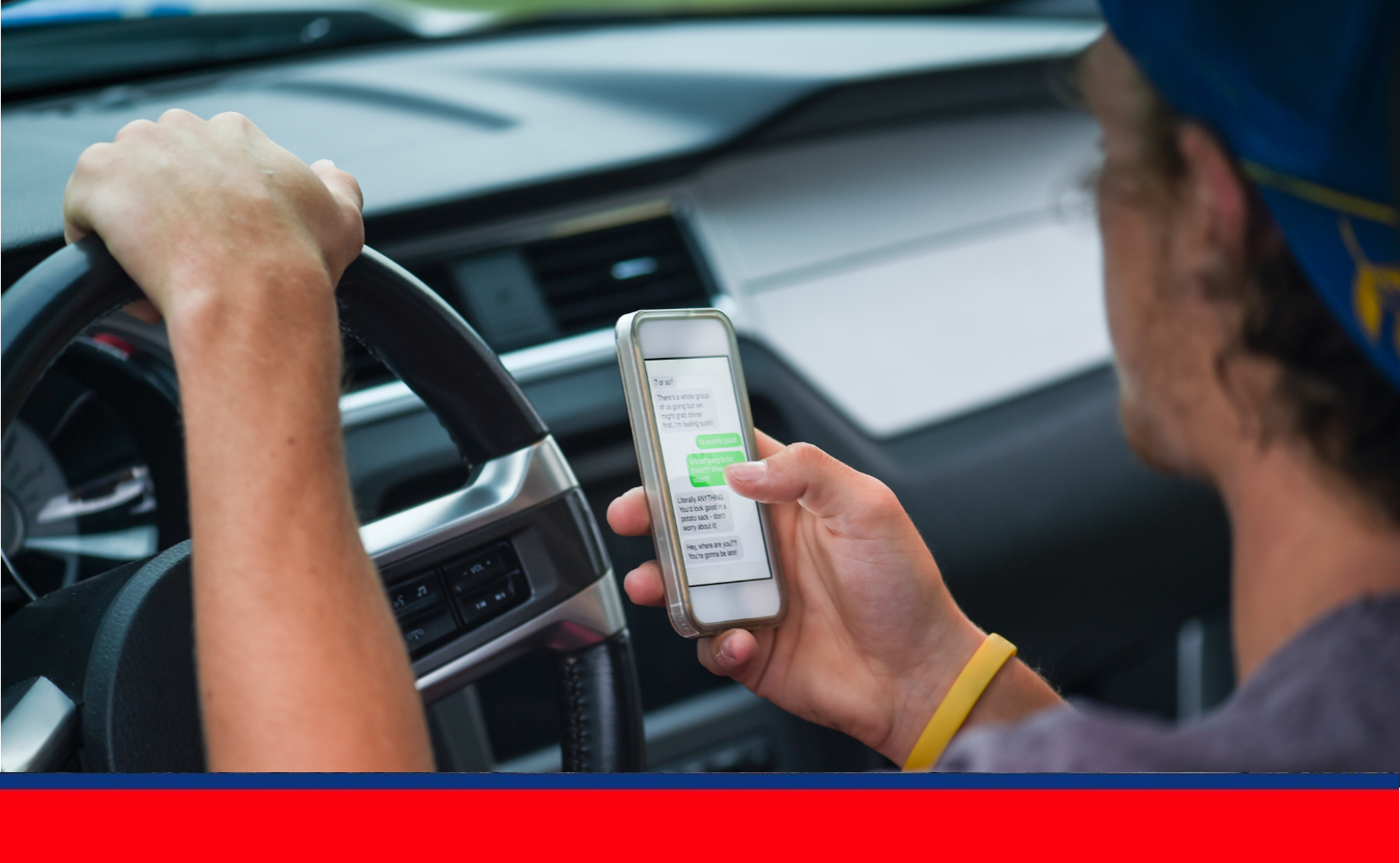 Young man distracted driver.png